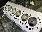 Cylinder head after cleaning and machining. Extra aluminium ground out in way of valves, water jacket holes drilled out
