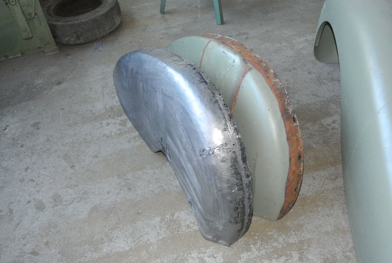 New rear wheel arch (left) with old rusted one removed