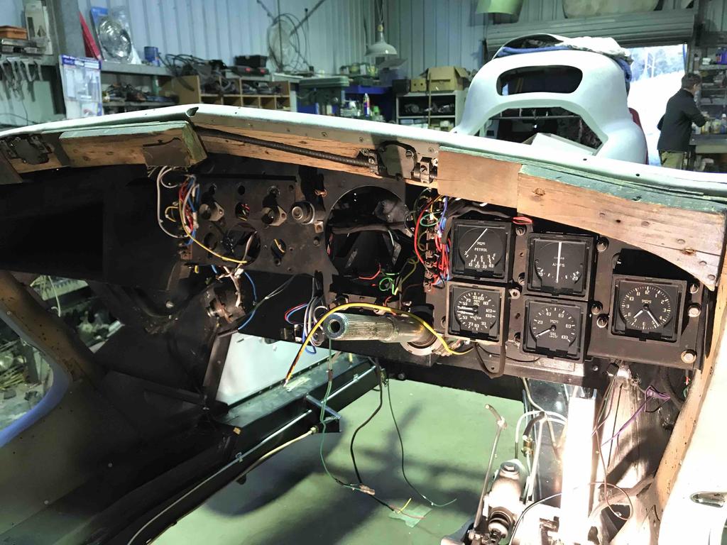Dash with restored gauges installed, timber is being renewed, new wiring harness installed